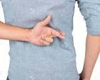 What is the meaning of You had your fingers crossed behind ...