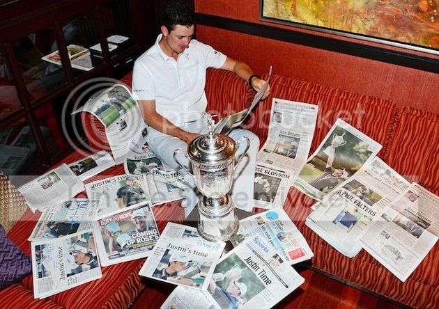 06golfjustinrosetrophyandnewspapers.jpg