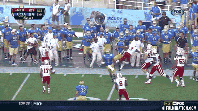 UCLA-player-bodychecks-coach.gif